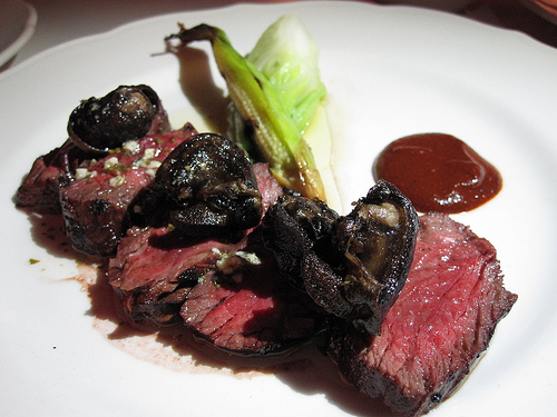 Hanger Steak and Crunchy Escargot with Baby Corn, Bok Choy and Black Olive Mole Sauce