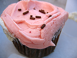 SusieCakes, Brentwood - Chocolate Cupcakes with Pink Buttercream Frosting and Chocolate Sprinkles