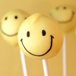 Smiley Face Cake Pops from Bakerella on TasteSpotting