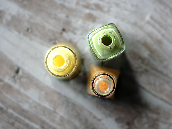 yellow, green glitter nail polish bottles