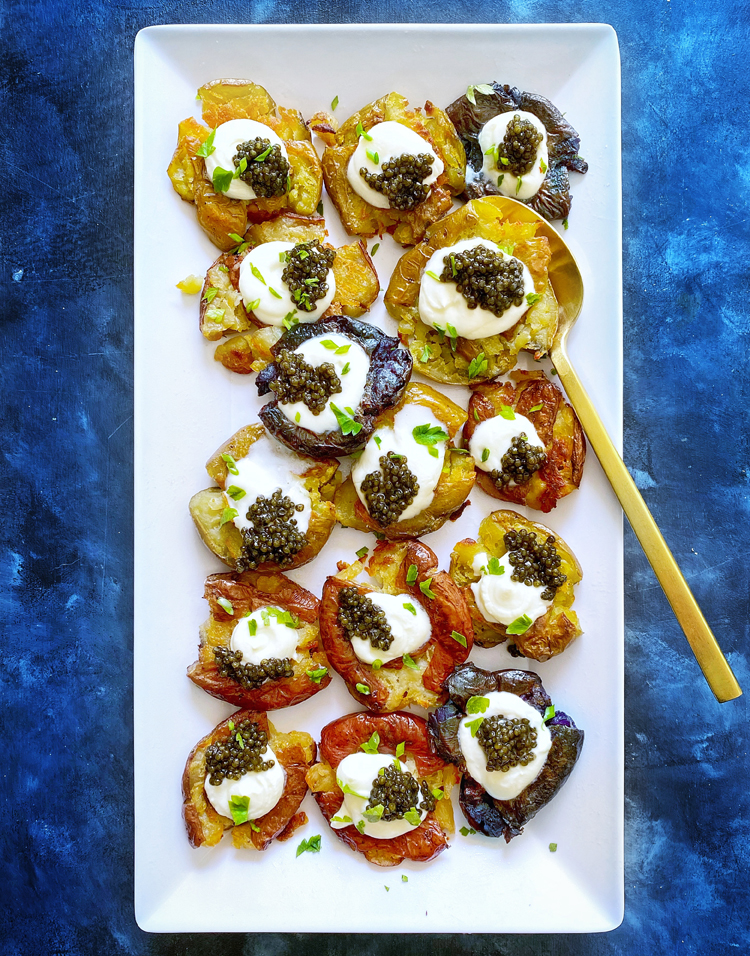 crispy smashed potatoes with yogurt and caviar