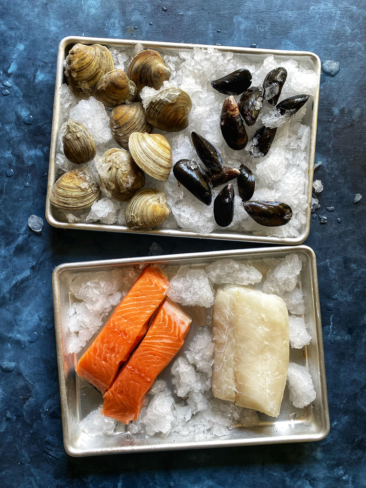 clams mussels salmon white fish on ice